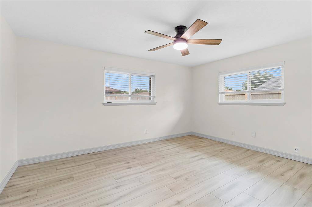 Bedroom 2 also faces the backyard and offers luxury vinyl plank flooring.