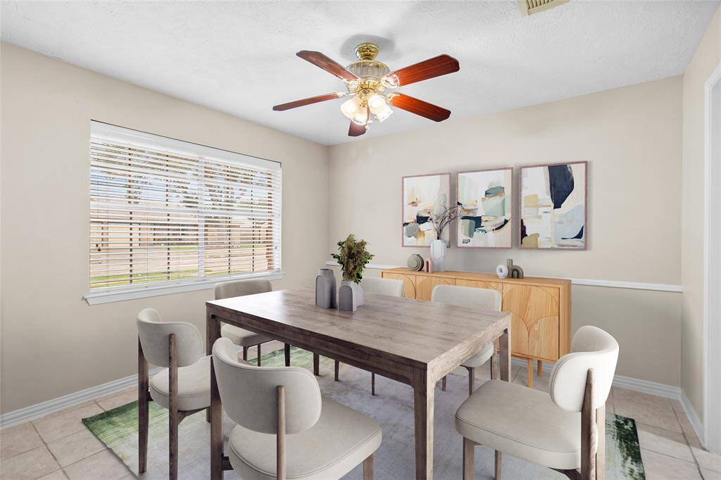 This front-facing room could be used as either a breakfast room or formal dining room, with a great view into the front yard.*Virtually Staged