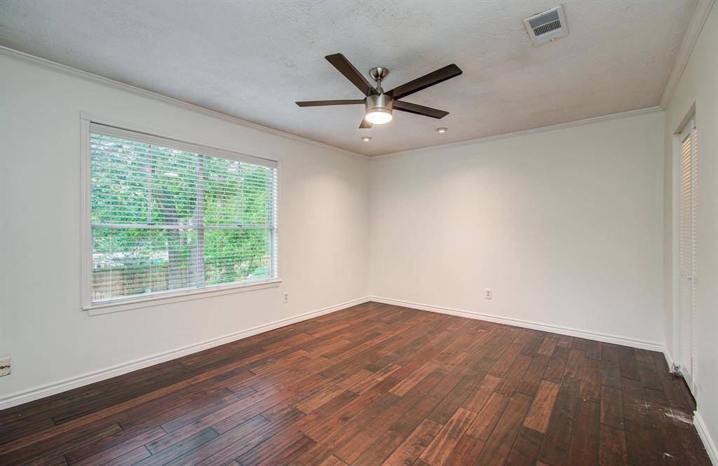 Primary bedroom #1 located facing back of the home.