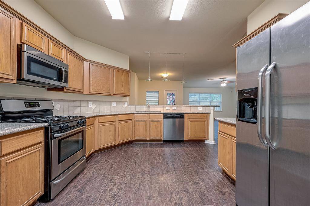 Recently Ugraded Kitchen with Granite Counters and Stainless Steel Sink.