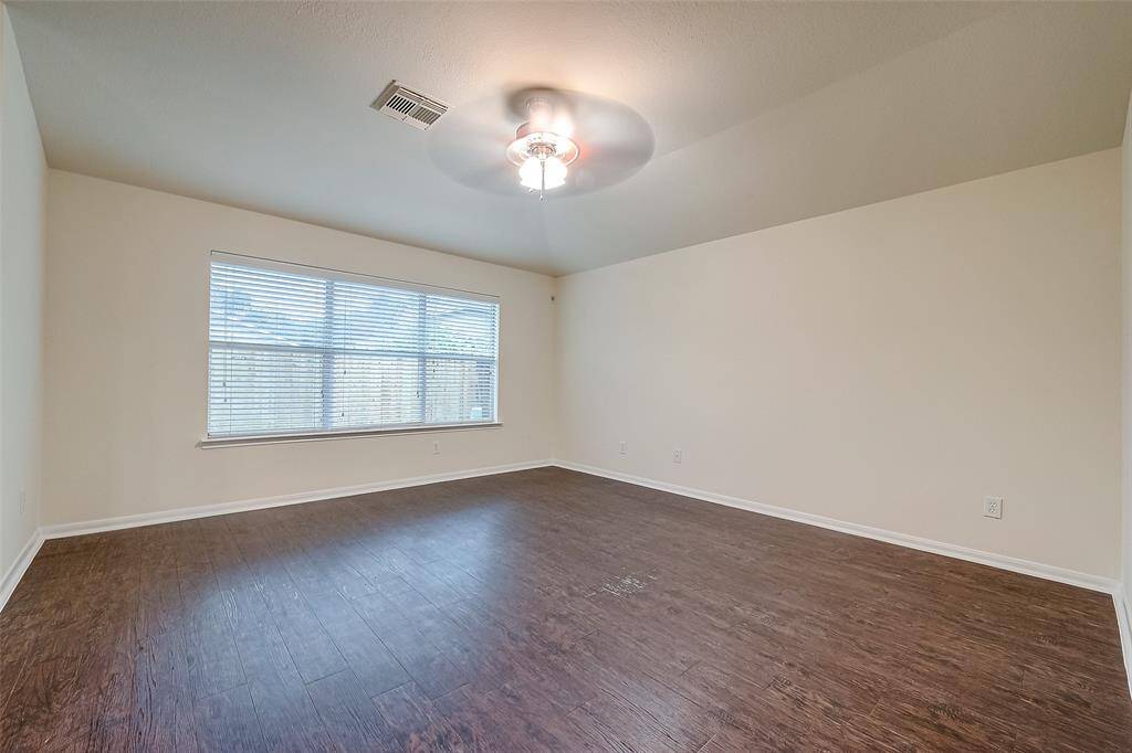 Large Den with Engineered Wood & Fan.