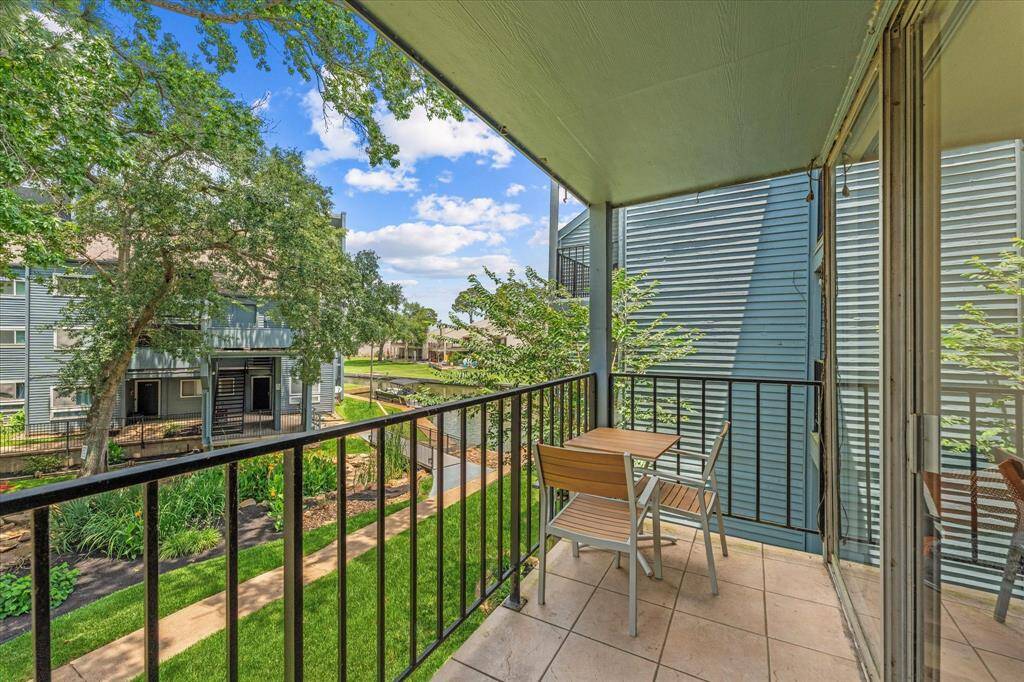 This cozy balcony offers a serene lake view, perfect for peaceful mornings or relaxing evenings.