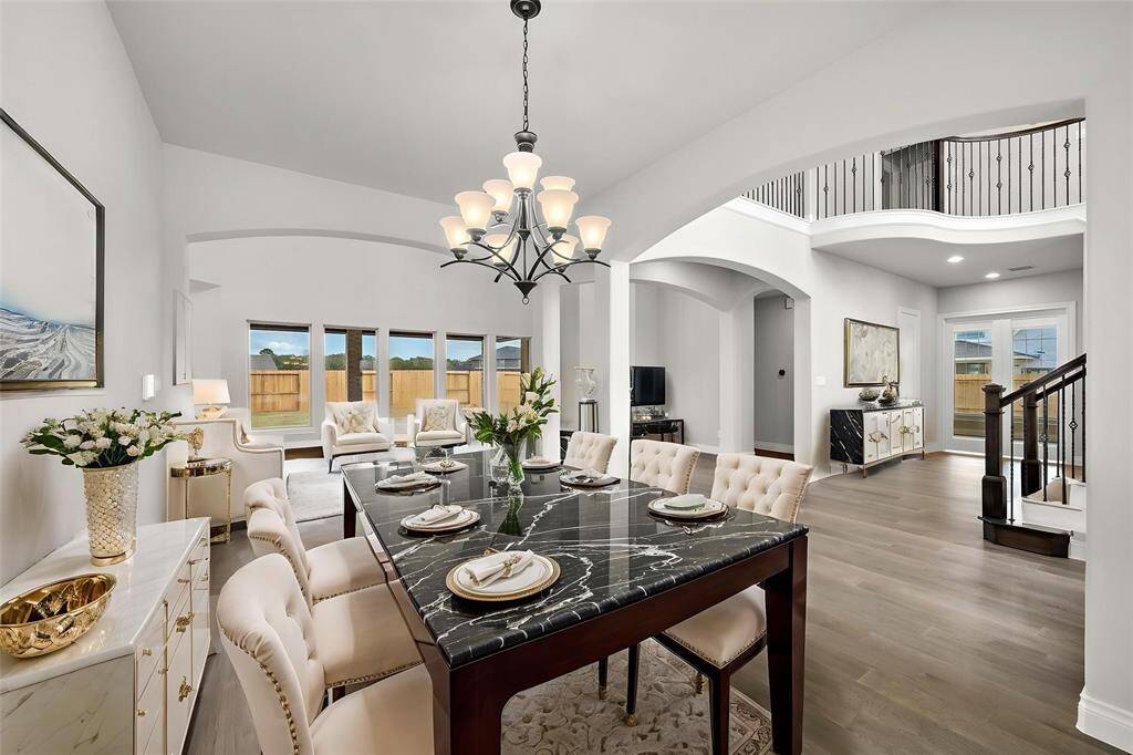Elegant formal dining room, perfectly positioned with open access to the main entry, kitchen, and living spaces. --This room has been virtually staged.