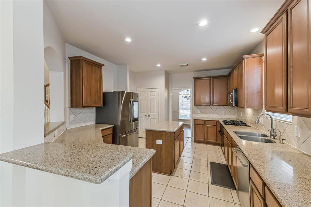 The kitchen is large and has plenty of counter and cabinet space.