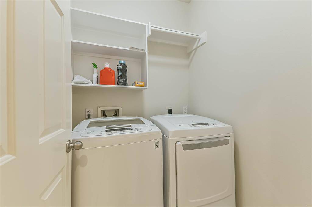 The utility room is inside the home and comes with a washer and dryer.