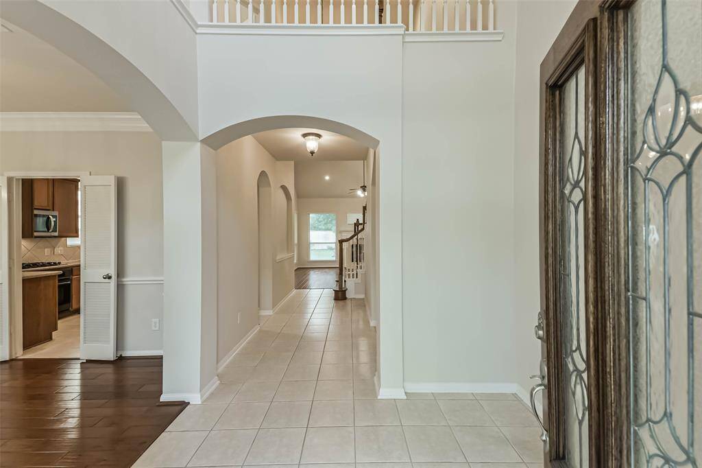 Great two-story entry with the formal dining room to the left.