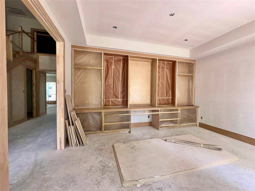 Handcrafted floor to ceiling shelving and cabinetry in the elegant study - under construction