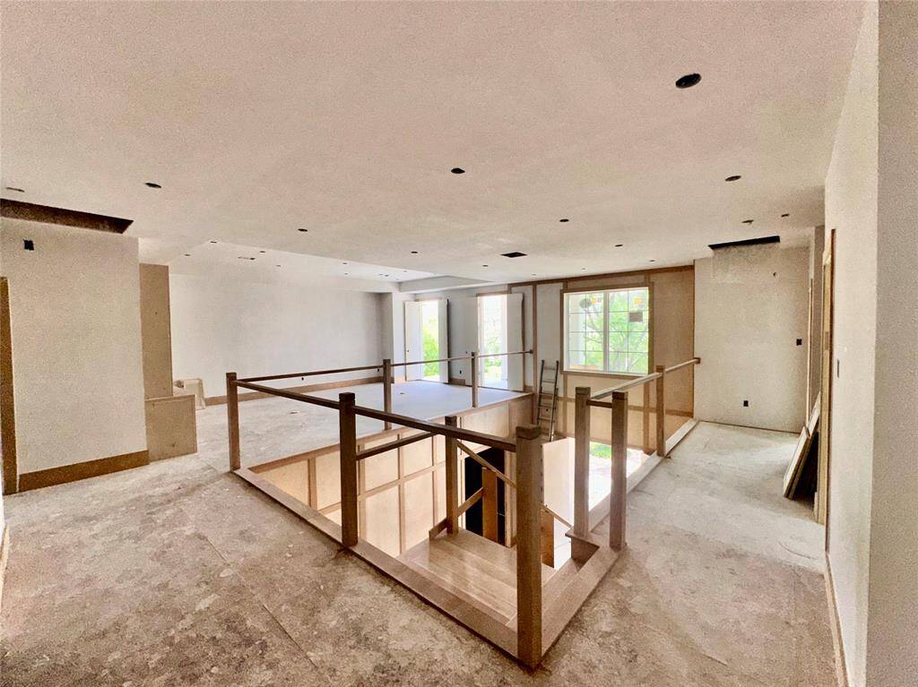 Another view of upstairs gallery and family room