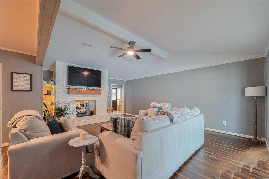 Family room shares a two sided fireplace with the living room