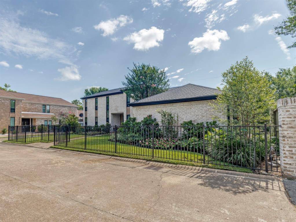 14132 Bluebird Lane has a professionally landscaped front yard and a wrought iron fence. What a great space for your children or pets to play safely.