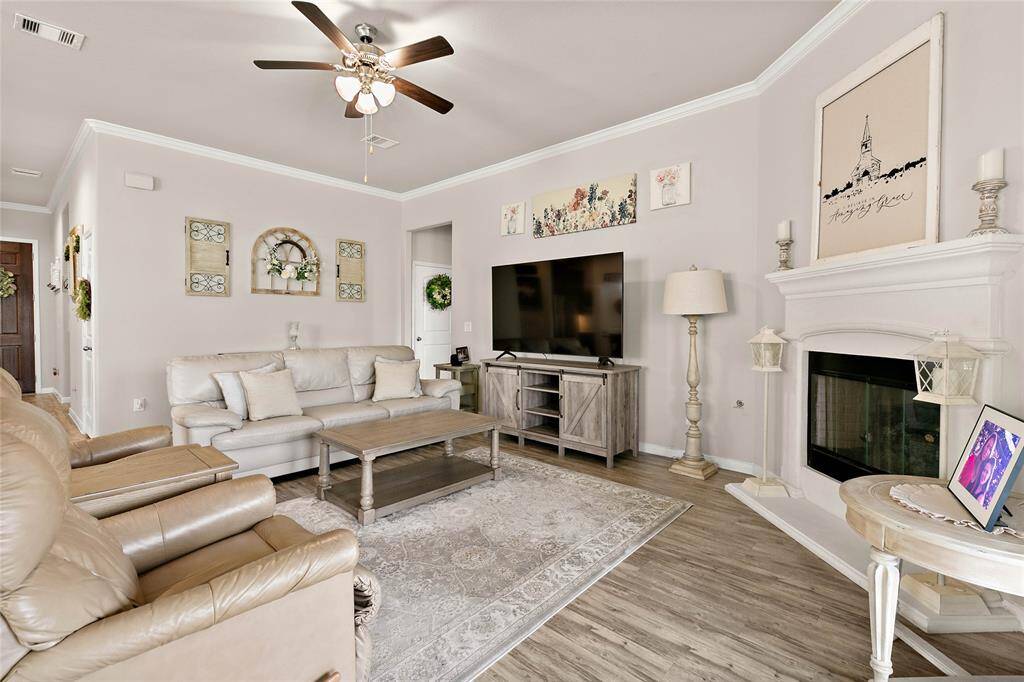 The cozy living room features a neutral color scheme.