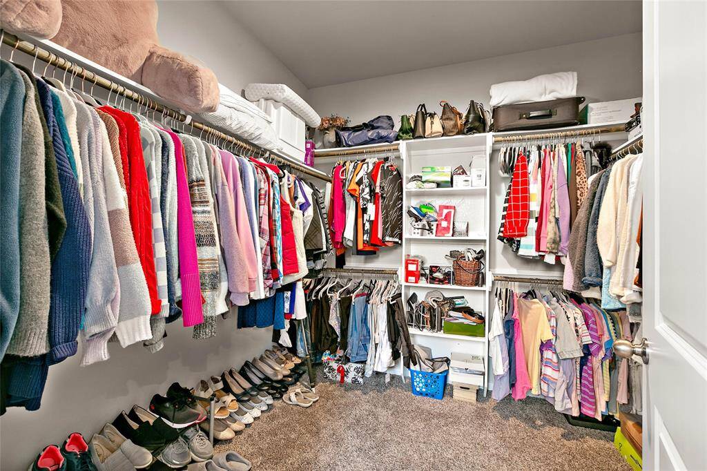 Primary closet has plenty of storage space for all your needs.