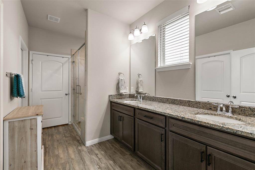The primary ensuite comes complete with dual vanities and a walk in shower.