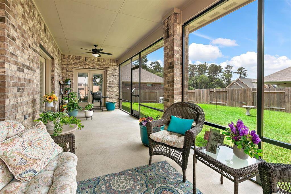 Spacious, screened-in patio complete with 2 ceiling fans and a gas stub is a lovey respite overlooking the quiet, well-maintained backyard.