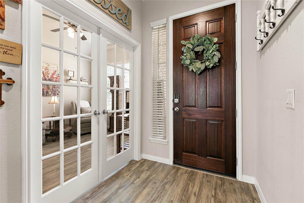 Behind the glass-paneled double doors is the study which could be used as a 3rd bedroom if needed as it comes complete with a closet.