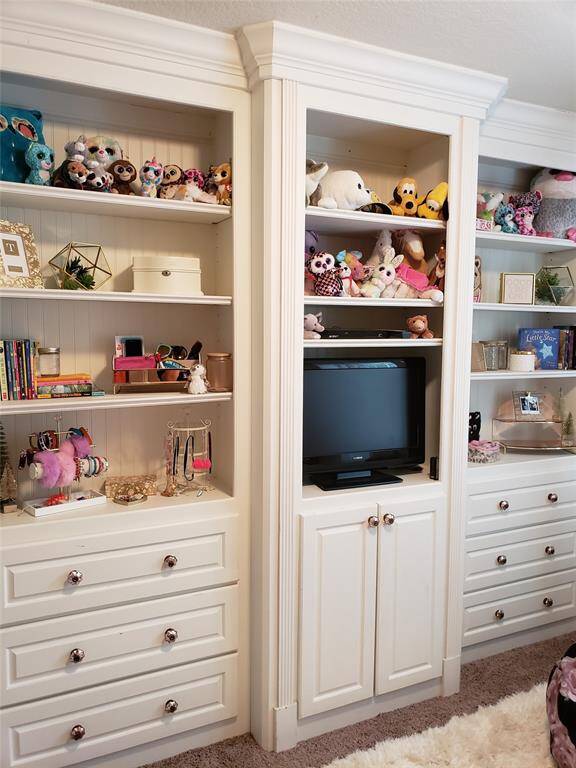 An excellent example of how thoughtful styling can bring built-ins to life—this setup blends playful charm with practical organization.