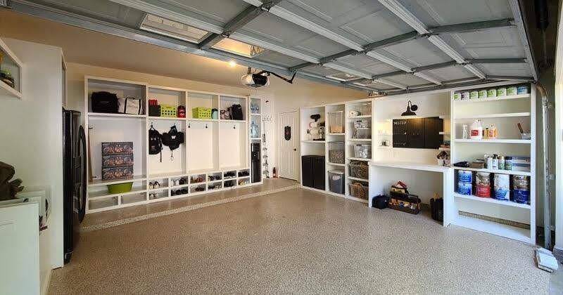 This alternate view of the finished garage looks back toward the interior access door, showcasing the seamless connection between house and garage.