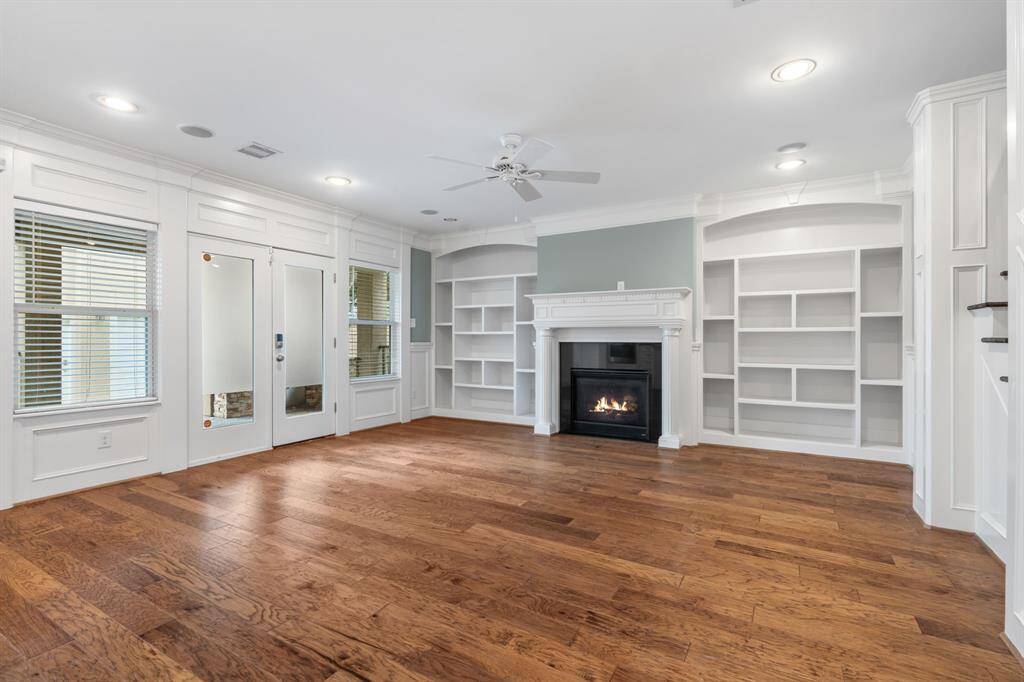 The living room offers custom built ins.