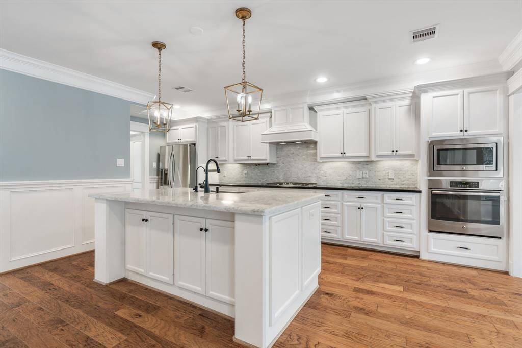 This kitchen offers an abundance of cabinets.