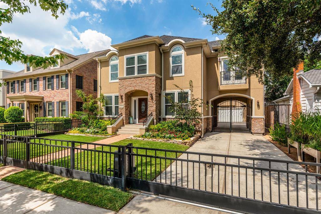 Home offers a rod iron gate around the perimeter.