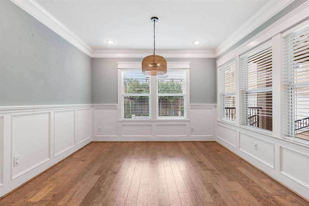Hard wood floors, recessed lighting and crown molding.