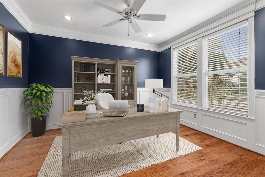 True hardwood floors, recessed lighting and double windows.