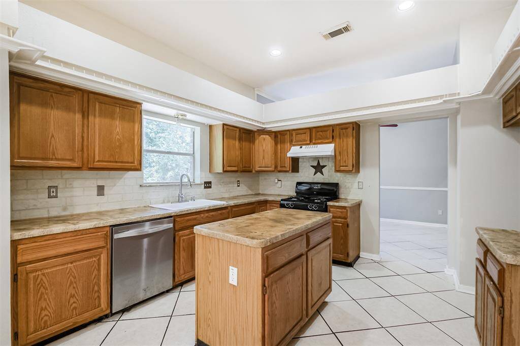 Ample cabinet space provides plenty of storage throughout the kitchen.