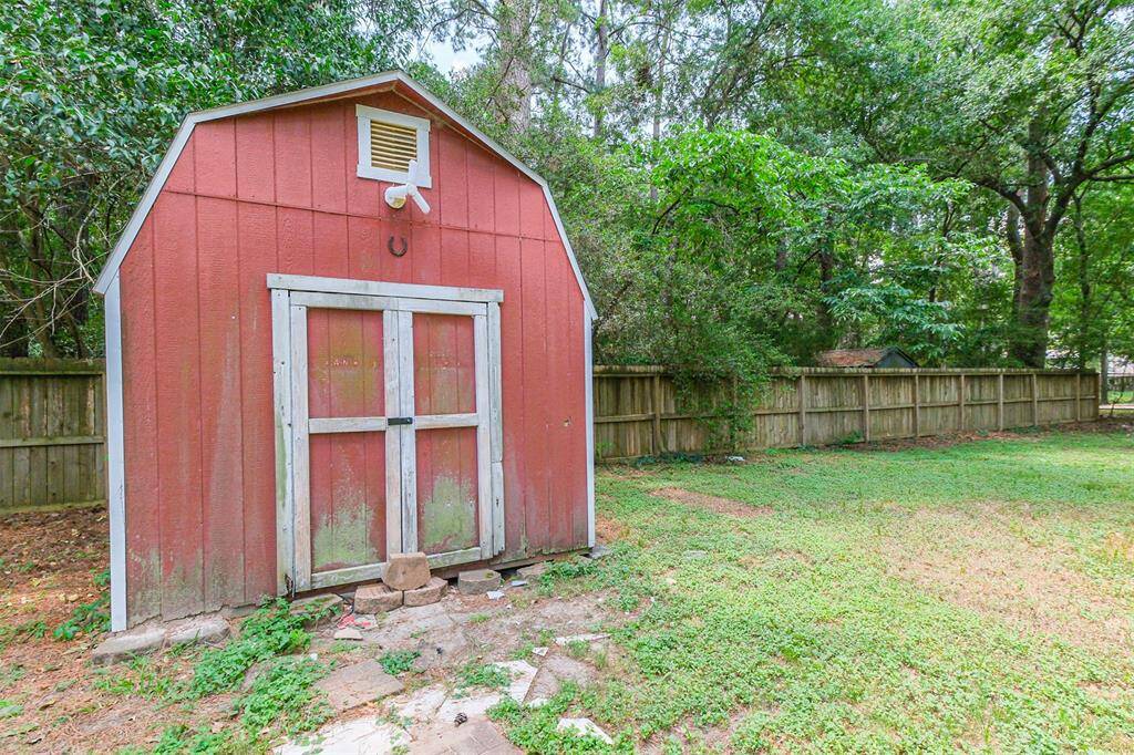 Separate storage building adds extra room for tools and equipment.