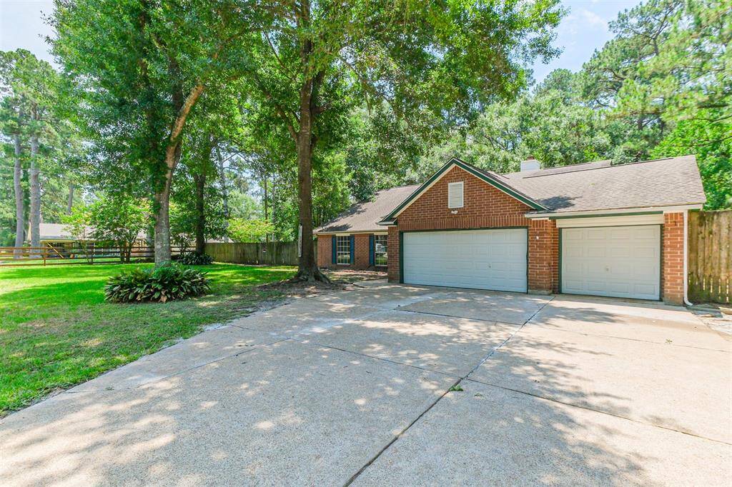 Wide driveway allows easy parking and access for multiple vehicles.