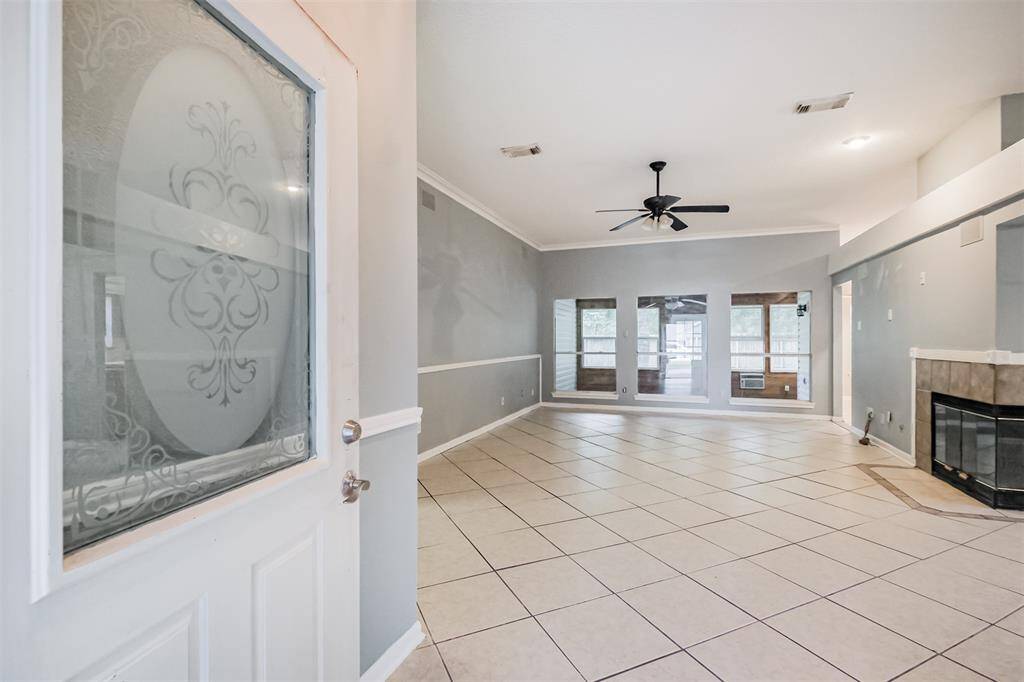 Step into the main living area featuring a cozy corner fireplace.