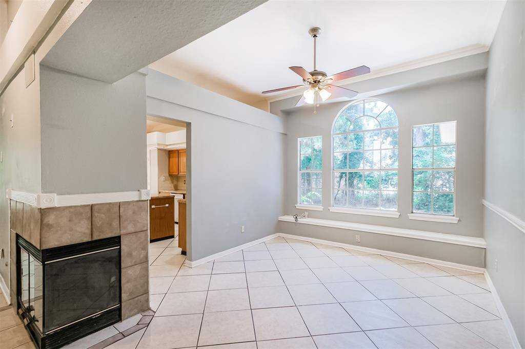 Dining area with a ceiling fan and built-in bench seating for added charm.