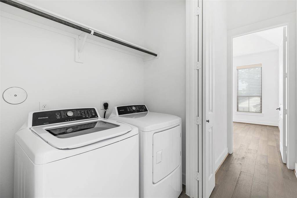 Laundry Room between the Game Room and Primary Bedroom