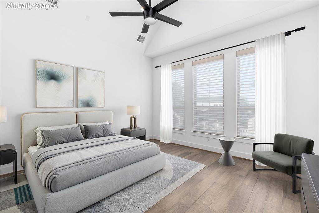 Spacious Primary Bedroom with Wifi connected Blackout Blinds and Vaulted Ceilings. *Virtually Staged*