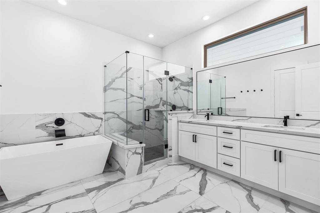 Beautiful En-suite with Modern Soaking Tub and Separate Shower with Double Sinks and plenty of Cabinet Space