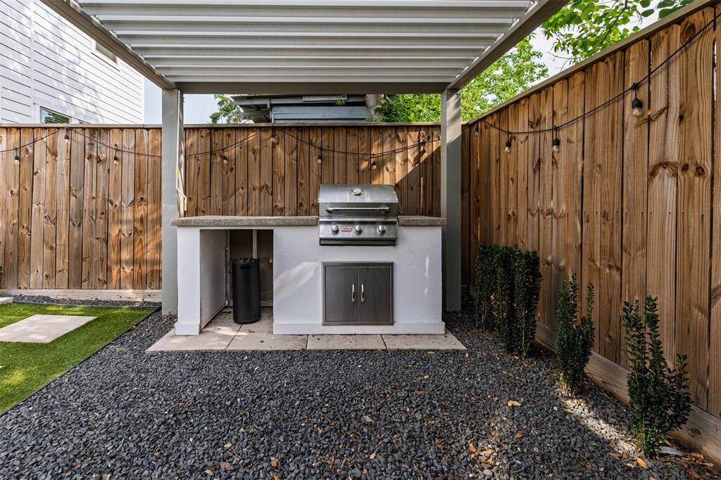 Built in Outdoor Kitchen with Louvered Pergola