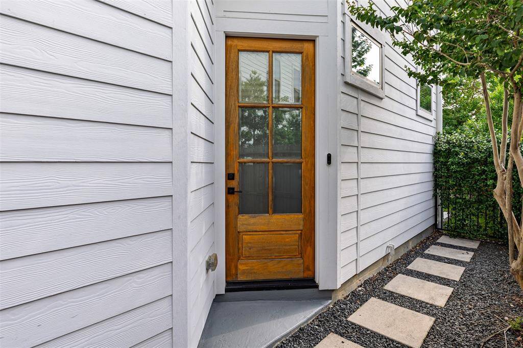 Door is located on the right-side of the Home for Privacy with Backyard Access through the Gate