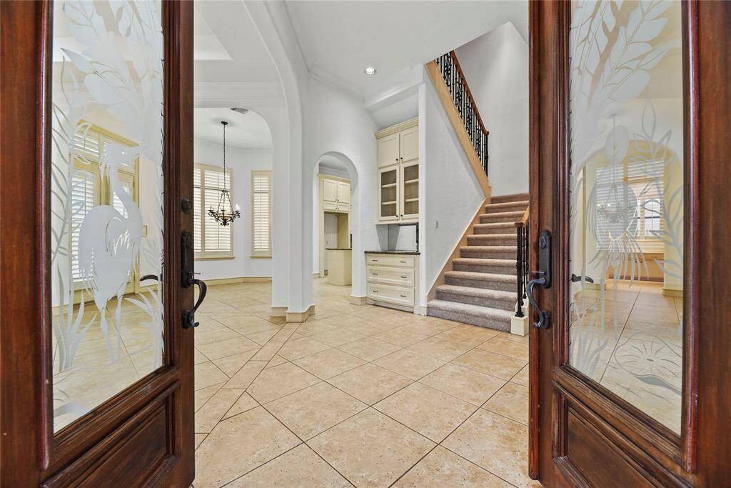 Elegant Double Doors greet your visitors into your stately home.
