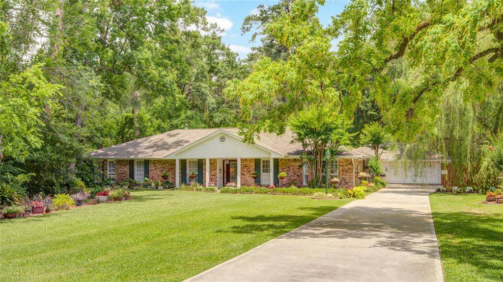 This charming ranch-style home is nestled on a spacious lot, over 35,000 Sq. ft. with lush landscaping and a welcoming front entry.