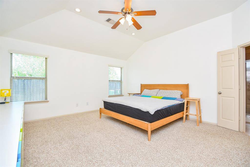 Spacious primary bedroom suite offering comfort and privacy.