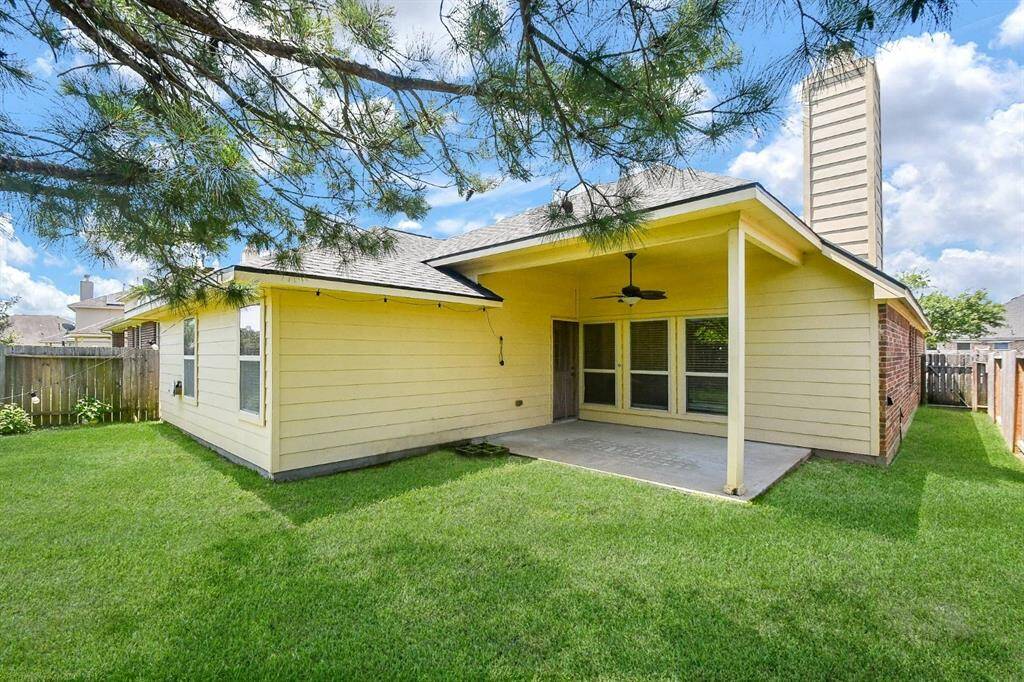 Private backyard with a covered patio, nestled among mature trees and no rear neighbors.