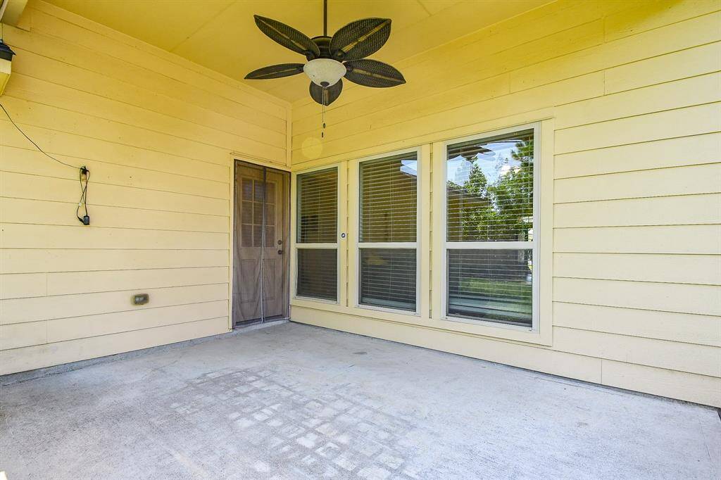 Private backyard with a covered patio, nestled among mature trees and no rear neighbors.
