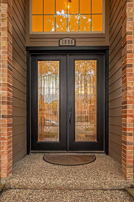 Palacial style double leaded glass doors greet you at the front entry.
