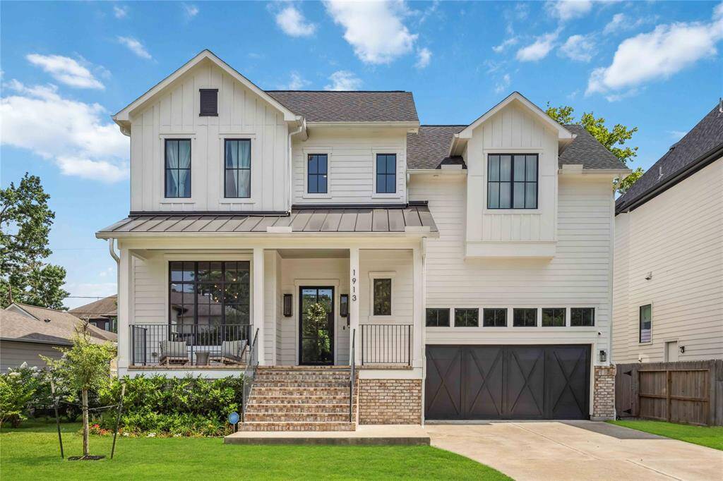 Built in 2022, this beautiful home’s dramatic front elevation showcases refined textures, designer symmetry, and an impressive entry.