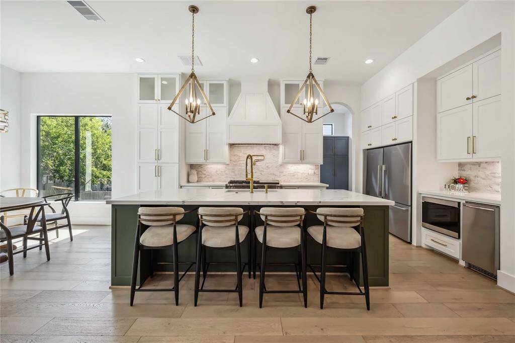 Chef's kitchen with beautiful designer fixtures.