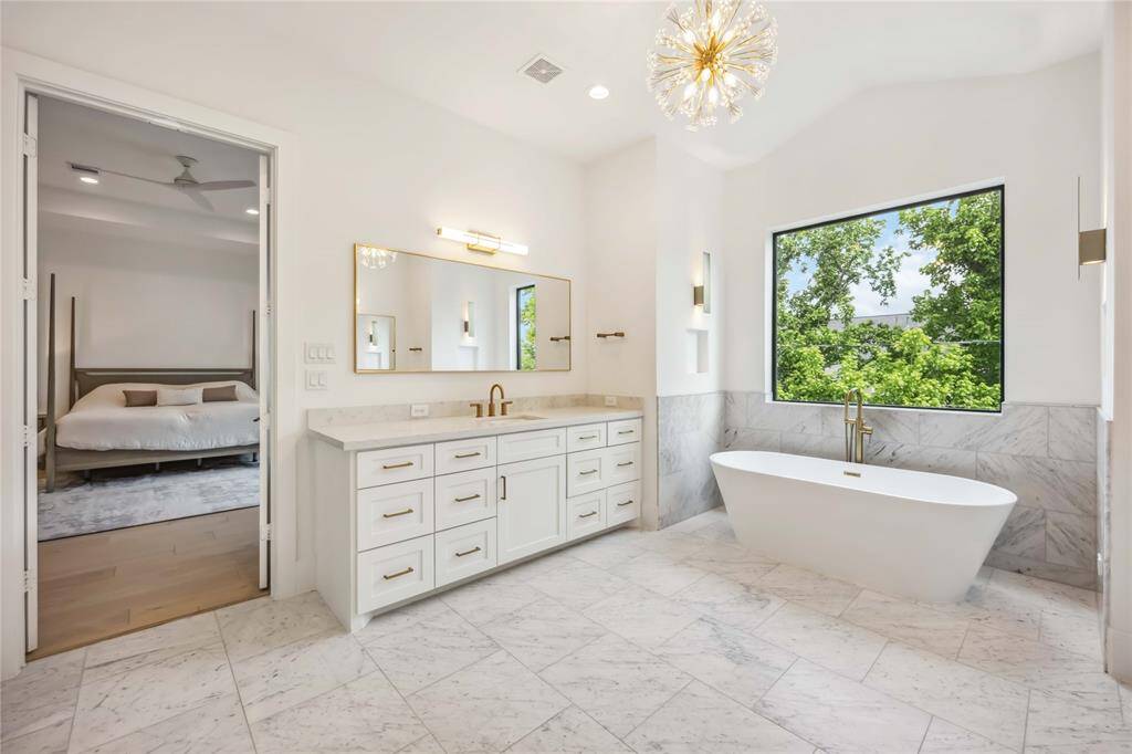 Versatile upstairs game room with endless potential for movie nights or play space.