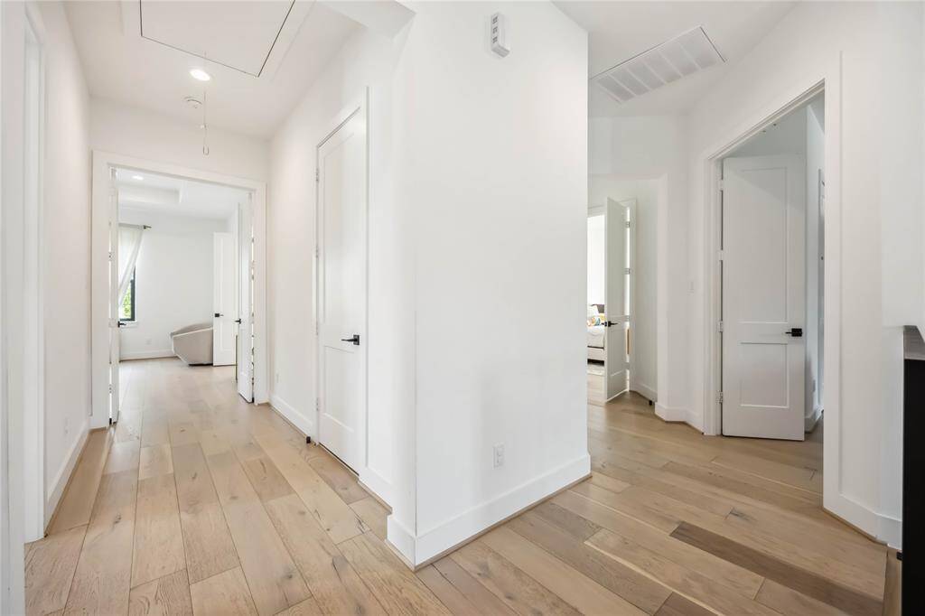 The additional fourth bedroom has a beautifully appointed full bath with a classic tub/shower combination, stylish tile work, and polished finishes throughout.