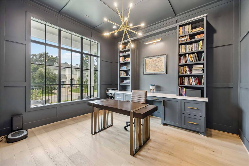 Designer powder room with bold fixtures, elevated finishes, and refined details—offering guests a taste of luxury.