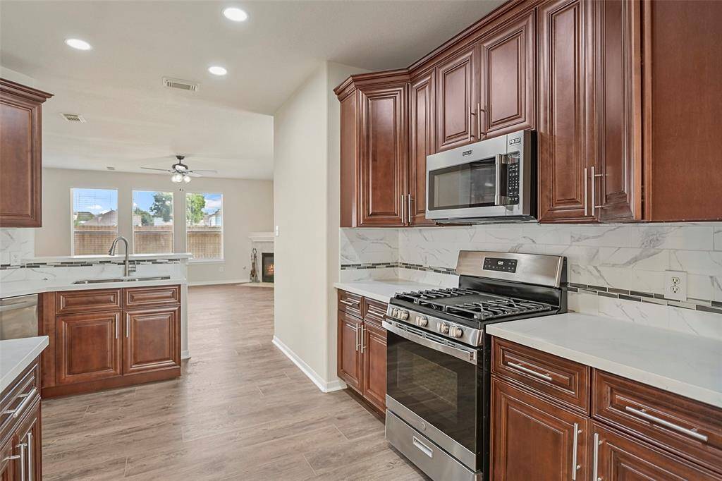 Welcome home to 19326 Camellia Knoll Trail...
