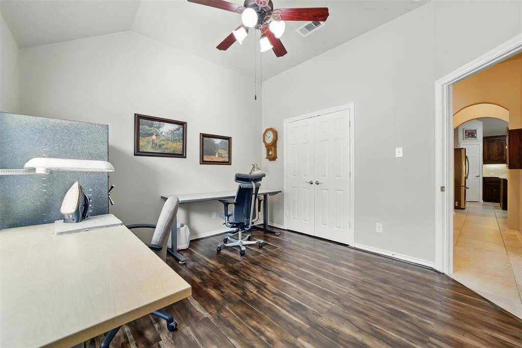 One of two secondary bedrooms with nicely sized closet, wood floors and neutral paint