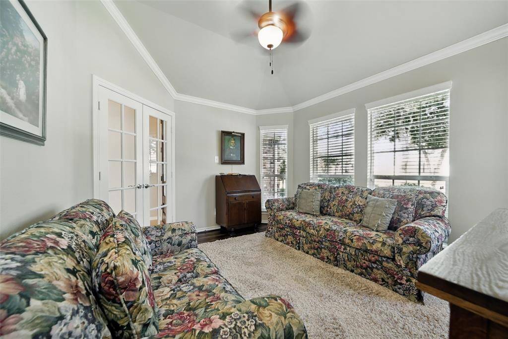 Study with french doors being utilized as formal sitting room